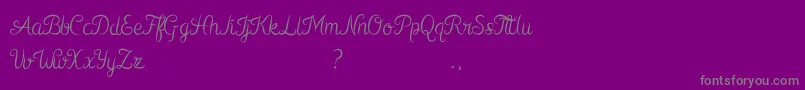 Kurnia-fontti – harmaat kirjasimet violetilla taustalla