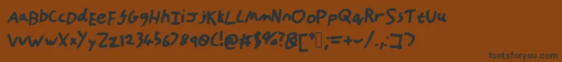HandOfTt Font – Black Fonts on Brown Background