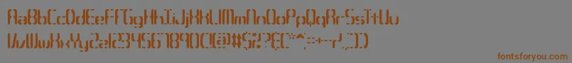 フォントCompc3s – 茶色の文字が灰色の背景にあります。