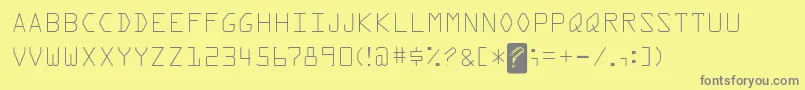 フォントKreditFront – 黄色の背景に灰色の文字