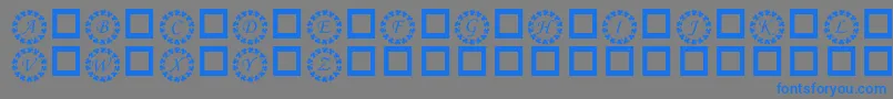 Czcionka KrRingOShams – niebieskie czcionki na szarym tle