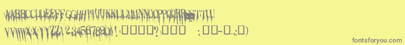 フォントCaracura – 黄色の背景に灰色の文字