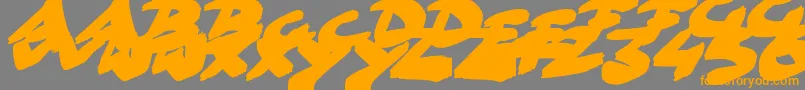 フォントGoFasterBrush – オレンジの文字は灰色の背景にあります。