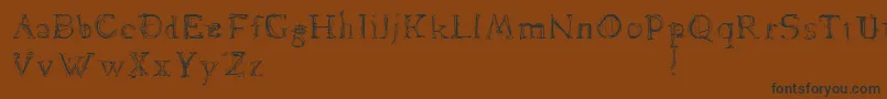 Dawnland.Lamenta Font – Black Fonts on Brown Background