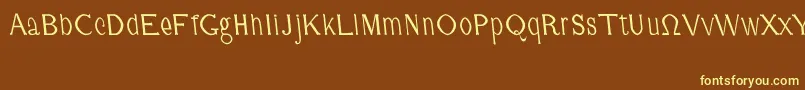CmFunnyRegular-fontti – keltaiset fontit ruskealla taustalla