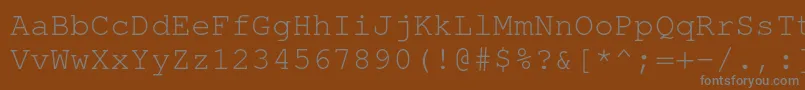 Fonte TexgyrecursorRegular – fontes cinzas em um fundo marrom