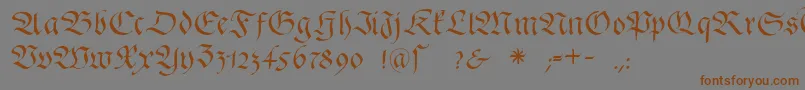 フォントFrakturafonteria – 茶色の文字が灰色の背景にあります。