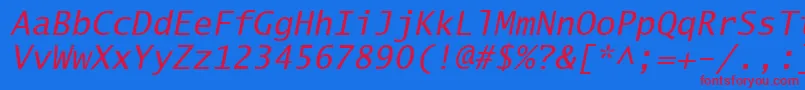 LucidaSansTypewriterOblique-fontti – punaiset fontit sinisellä taustalla