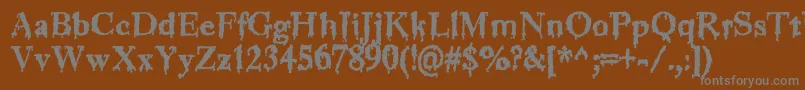 Jinkeez-Schriftart – Graue Schriften auf braunem Hintergrund