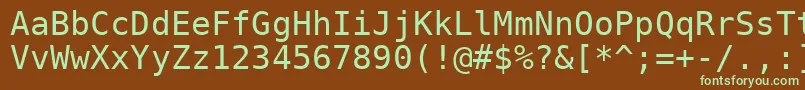 フォントDejavu – 緑色の文字が茶色の背景にあります。