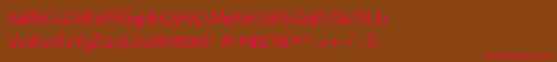 フォントDanila – 赤い文字が茶色の背景にあります。