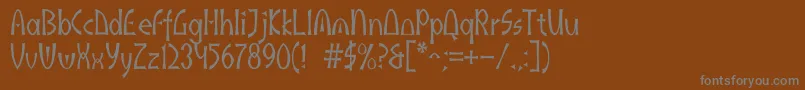 Akaindic-Schriftart – Graue Schriften auf braunem Hintergrund
