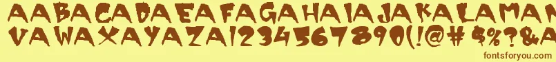 フォントScary – 茶色の文字が黄色の背景にあります。