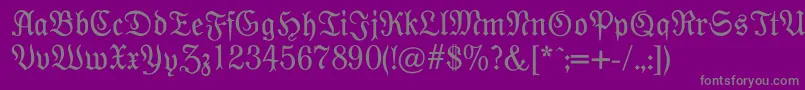 Modernefraktur-fontti – harmaat kirjasimet violetilla taustalla