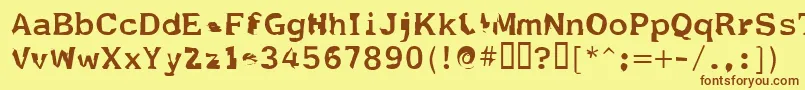 フォントFildnik – 茶色の文字が黄色の背景にあります。