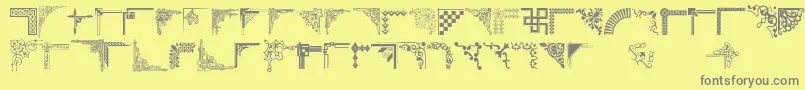 フォントCornpop – 黄色の背景に灰色の文字