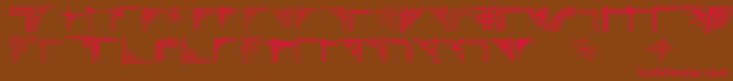 フォントCornpop – 赤い文字が茶色の背景にあります。