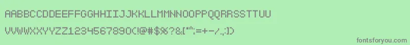 Sgk001-fontti – harmaat kirjasimet vihreällä taustalla