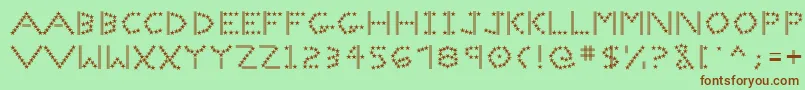 Spangledmast-Schriftart – Braune Schriften auf grünem Hintergrund