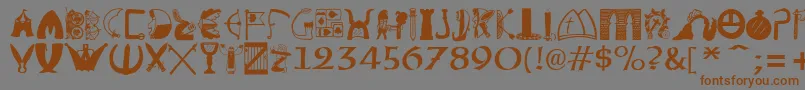 フォントBriaroakShire – 茶色の文字が灰色の背景にあります。