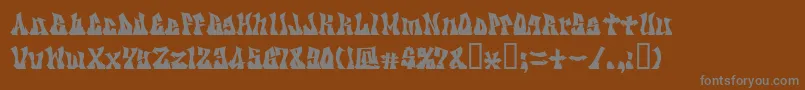 Kzgravity-fontti – harmaat kirjasimet ruskealla taustalla