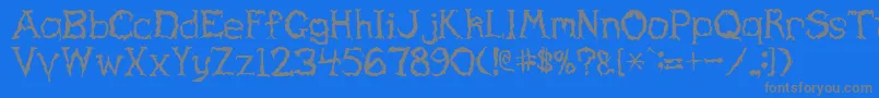 フォントHauntedRegular – 青い背景に灰色の文字