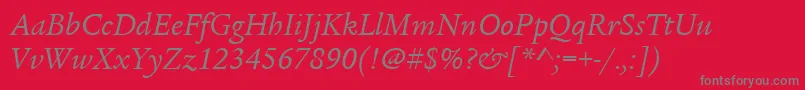 ItcLegacySerifLtBookItalic-fontti – harmaat kirjasimet punaisella taustalla
