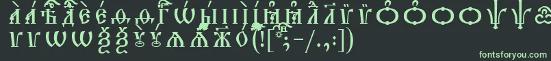 フォントTriodionCapsIeucsSpacedout – 黒い背景に緑の文字