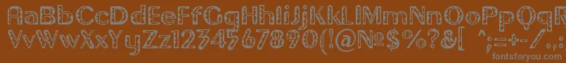 フォントGilgont – 茶色の背景に灰色の文字