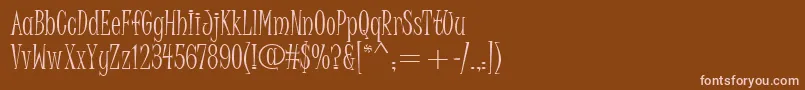 JuiceItc-Schriftart – Rosa Schriften auf braunem Hintergrund