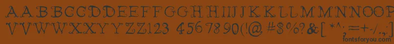 FairiesWearBoots-fontti – mustat fontit ruskealla taustalla