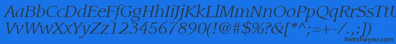 ItcLeawoodLtBookItalic Font – Black Fonts on Blue Background