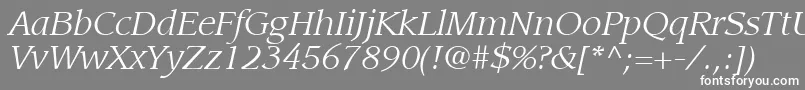 ItcLeawoodLtBookItalic-fontti – valkoiset fontit harmaalla taustalla