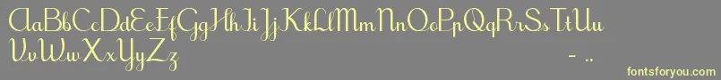 TegakBersambungIwk Font – Yellow Fonts on Gray Background