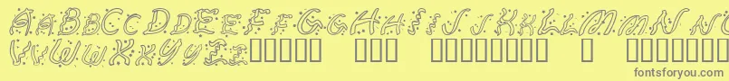 RubanExtravaganza-Schriftart – Graue Schriften auf gelbem Hintergrund