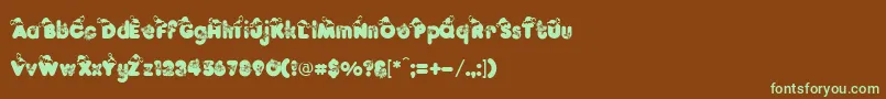 フォントKringleRegular – 緑色の文字が茶色の背景にあります。