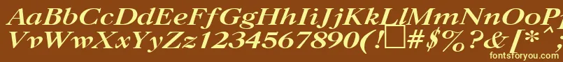 UkCaslonBoldItalic-fontti – keltaiset fontit ruskealla taustalla