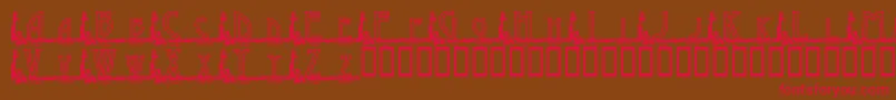 フォントKgGaylesLh – 赤い文字が茶色の背景にあります。