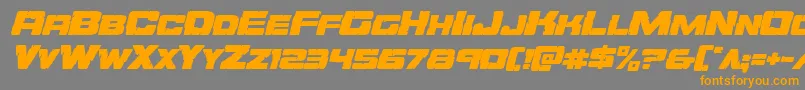 フォントOrecrusherexpandital – オレンジの文字は灰色の背景にあります。