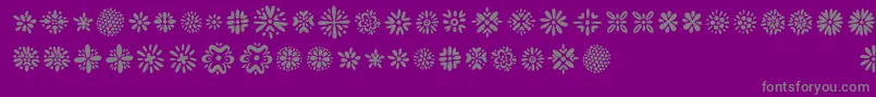 Kembang-fontti – harmaat kirjasimet violetilla taustalla