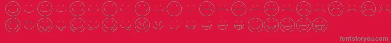 Fonte SmileyRegular – fontes cinzas em um fundo vermelho