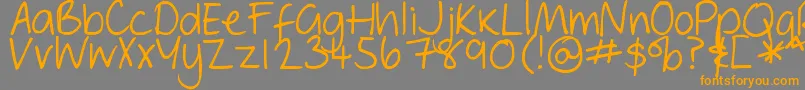 フォントDjbGeordieGirl – オレンジの文字は灰色の背景にあります。