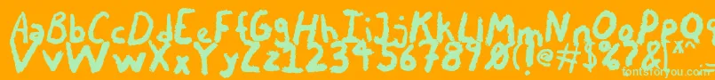 ChalkyChicken-Schriftart – Grüne Schriften auf orangefarbenem Hintergrund