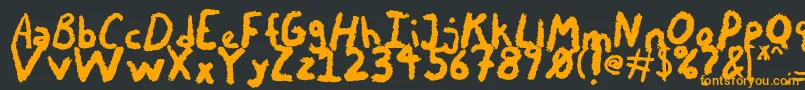 フォントChalkyChicken – 黒い背景にオレンジの文字
