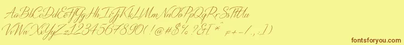 フォントDistantStroke – 茶色の文字が黄色の背景にあります。