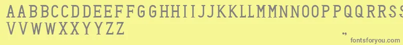 フォントHoneyBadger – 黄色の背景に灰色の文字