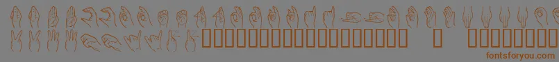 フォントHandsign – 茶色の文字が灰色の背景にあります。