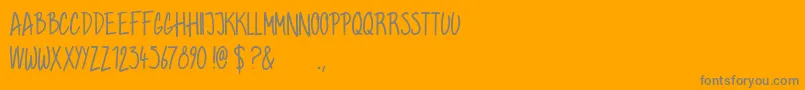 Grahamhand-Schriftart – Graue Schriften auf orangefarbenem Hintergrund