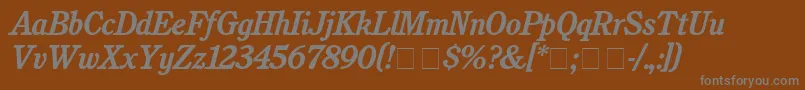 CushingBolditalic-fontti – harmaat kirjasimet ruskealla taustalla
