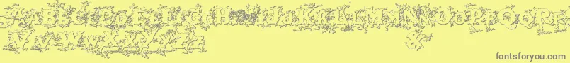 Darkwoodbeveled-Schriftart – Graue Schriften auf gelbem Hintergrund